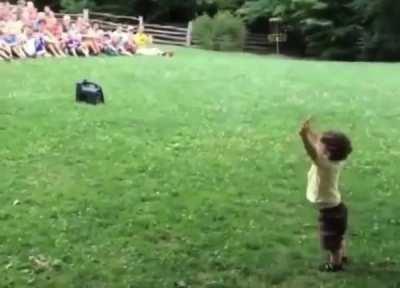 Boy thinks the crowd gathered for him. Adorable, but still fits
