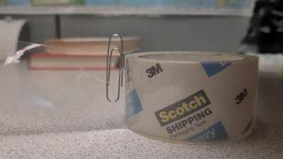 Paperclip on packaging tape. MIC DROP.