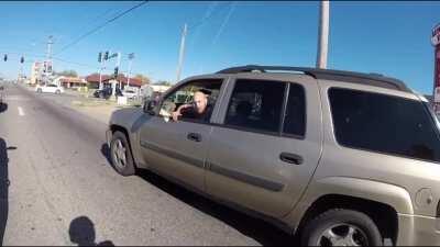 Idiot biker doing a wheelie nearly hit by overtaking vehicle (who was also arguably being reckless)