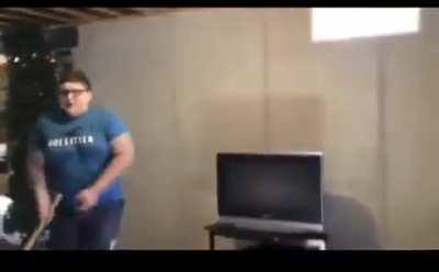 Ungrateful kid smashes tv with a bat