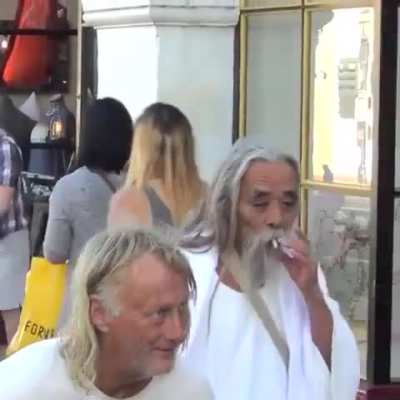 Guy tries to public prank the coolest Jesus-looking street dude.. instead he gets a master-course in idgaf therapy..