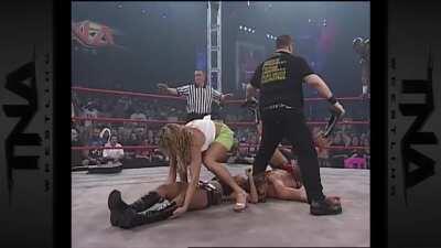 Gail Kim low blowed from the turnbuckle