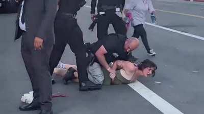 [Insane] In Los Angeles, leftist/Democrat pro-abortion activist attempts to block Democrat president Biden's motorcade. She is quickly tackled by Secret Service.