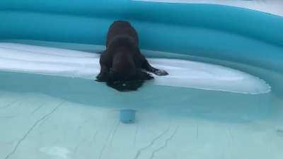 She tries to breathe under water.