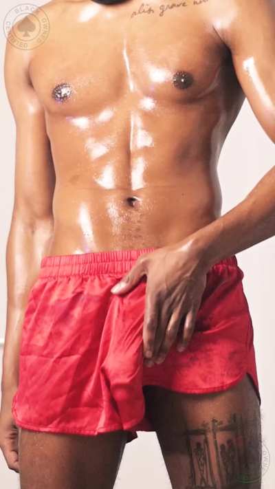 ✨ Oiled skin. Red shorts. Bulge begging for attention.