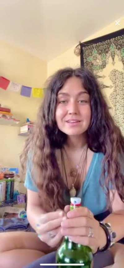 As she bends forward