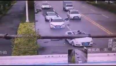 Who is throwing poles out of balconies on road?