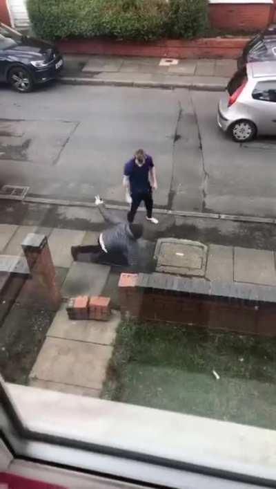 Car thief crashes into wall with a little help from a passer-by's fist.