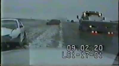 Porsche 944 loses control, spins and crash tow truck.