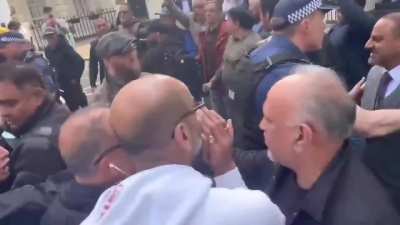Pakistani and Indian protestors engage in a shouting match in London following recent tension between India and Pakistan