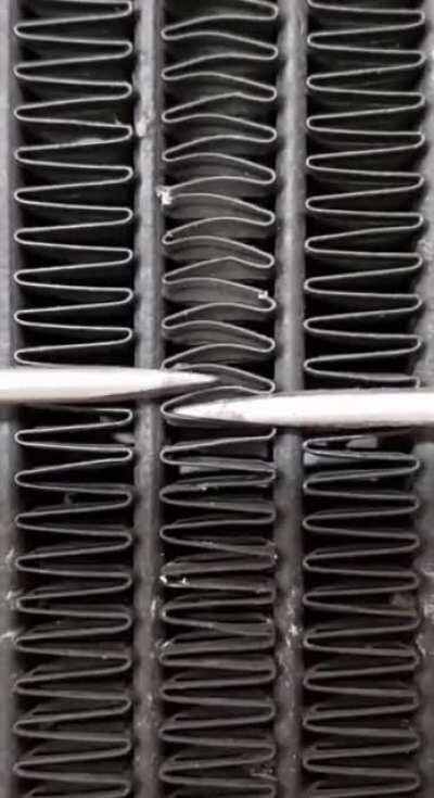 Fixing a motorcycle radiator.