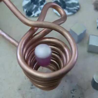 Levitation melting suspends and melts metal with induction heating inside a magnetic