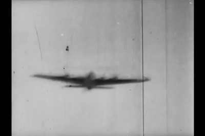Luftwaffe fighter flying through the parts shot off a B-17 Flying Fortress