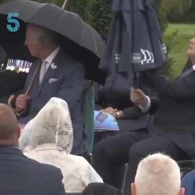 ...To put up an umbrella by UK PM, Boris Johnson