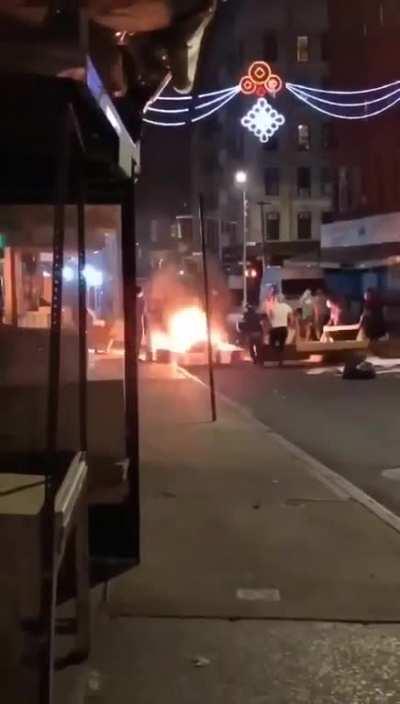Protestors burning down Chinatown fruit stands