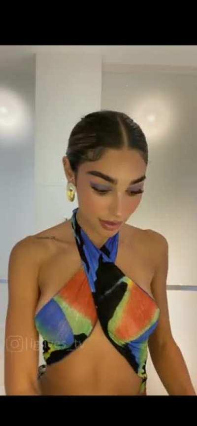 Pulling her top down