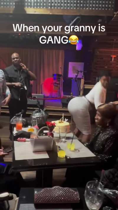 Throwing cheeks in her grandmothers face