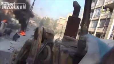 Al-Nusra rebels desperately try to save wounded comrades after their convoy was ambushed in Aleppo (2012)