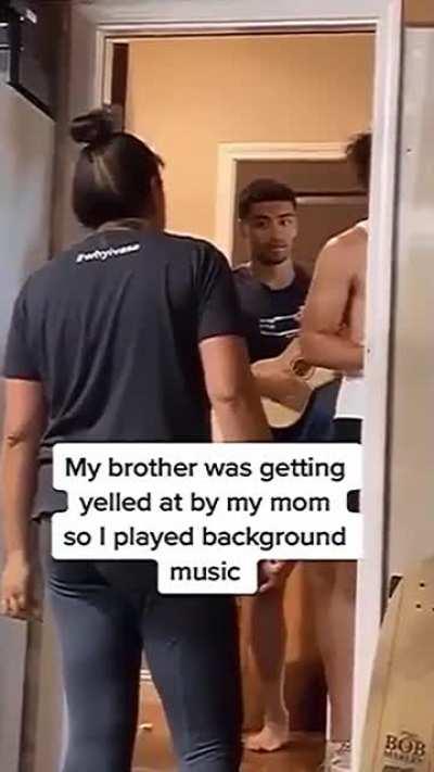 Son plays ukulele to make situation better