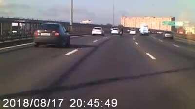 Driver protects biker