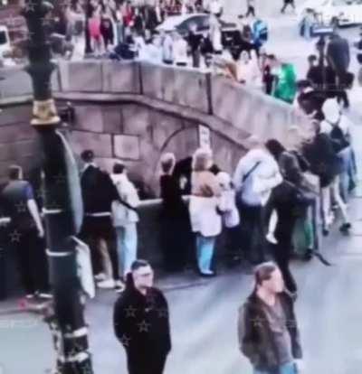 The guy was not strong enough and dropped his girlfriend into the water