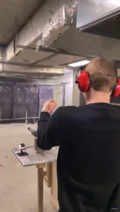 How not to shoot a revolver; guy bump fired and almost taps his head with the second shot