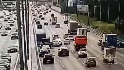 Rear wheel breaks off a car on a busy road and causes quite a pileup