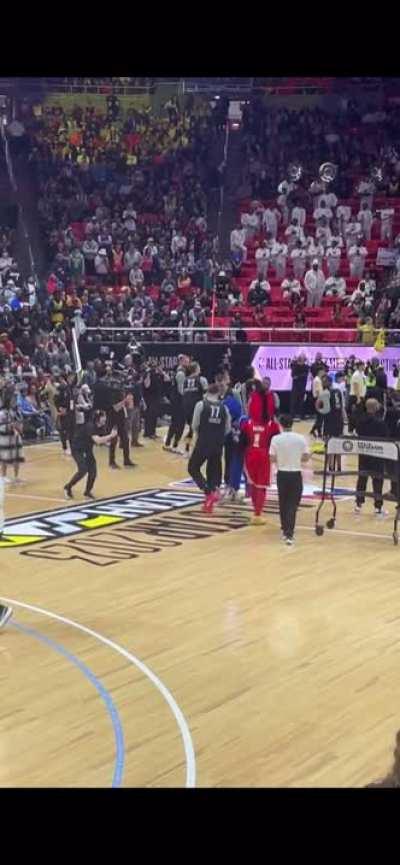 Luka saw the 76ers mascot hit an amazing backwards half-court shot and tried to do the same thing