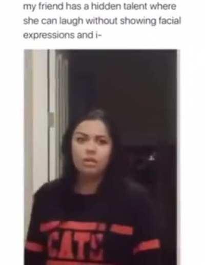 This girl laughing without any facial expression