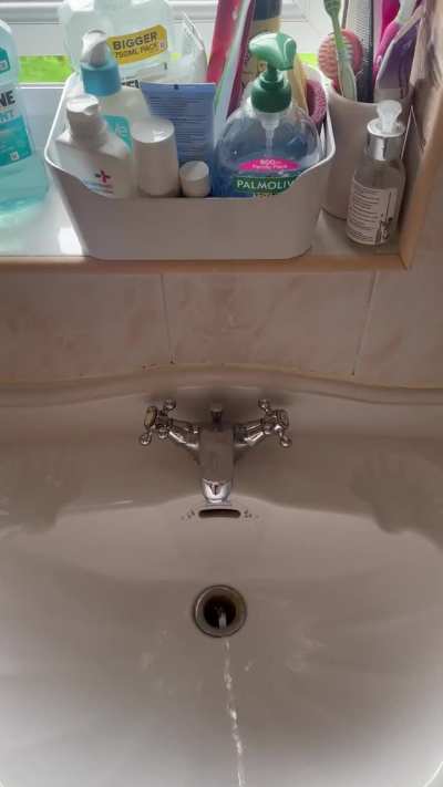 Taking a piss in the bathroom sink in the house my dad has been renting a room in