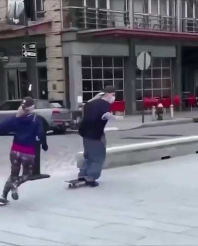Woman tries to stop dude from skateboarding to protect her city