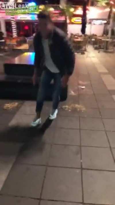 Idiot tries to kick pigeon but instead slips and falls in puke.