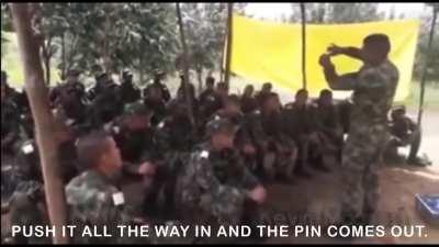 Instructor teaching a class how to use a grenade plays a prank.