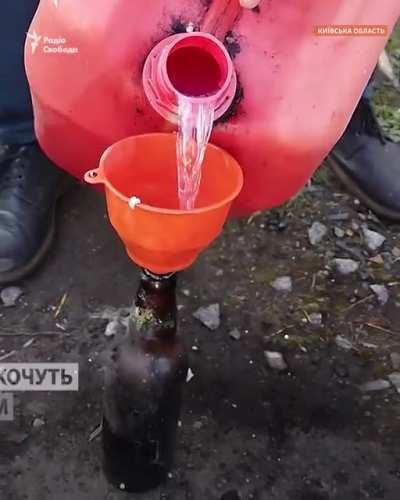 Ukrainian civilians making molotovs in anticipation of russian attack