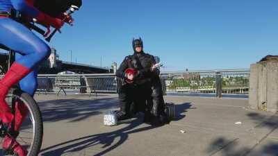 Batman playing uke.