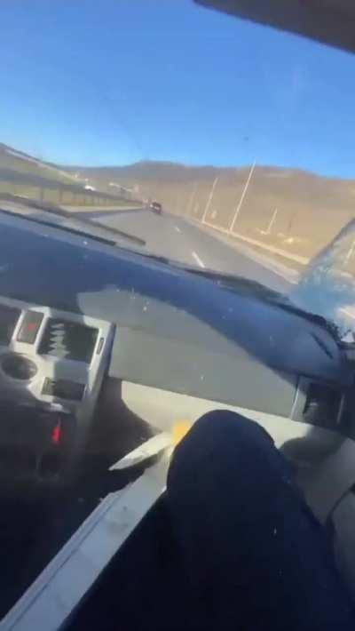 Main character reckless driver hits his car behind a truck.