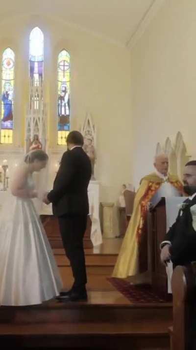 An Irish priest forgets to announce the first kiss at a wedding