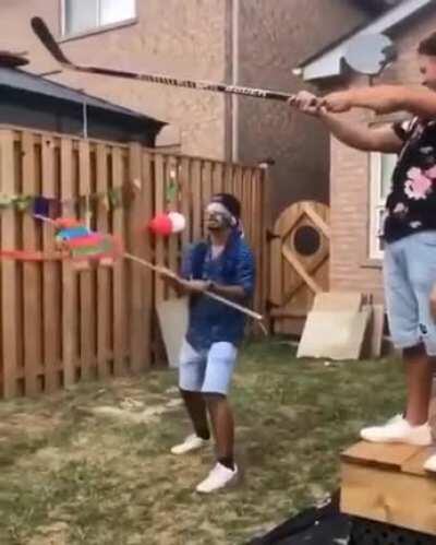 WCGW holding a piñata