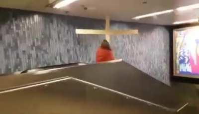 Jesus on escalator