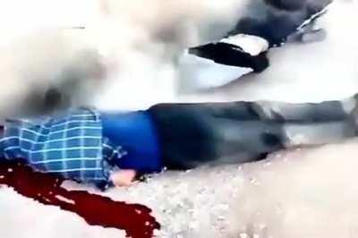 Syrian army regime soldiers execute a group of detained civilians. NSFW!