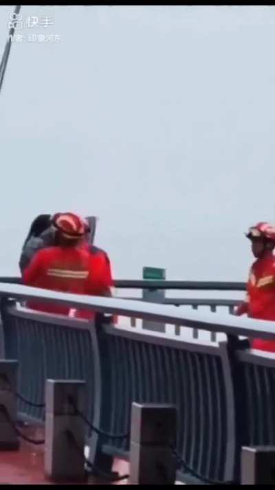 firefighters saving people from committing sewage pipe