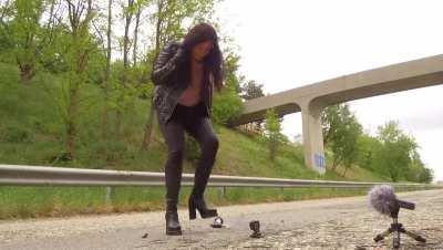 Vivi stomping a roach in boots