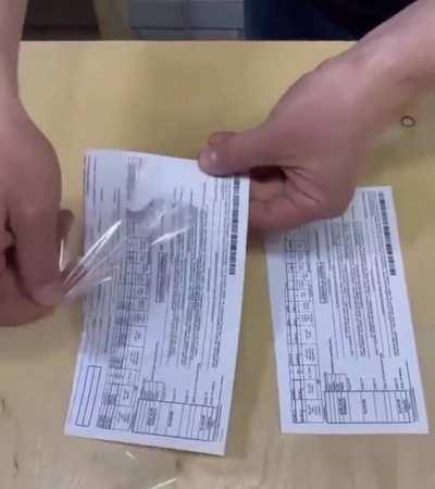 Remove taped paper without tearing it.