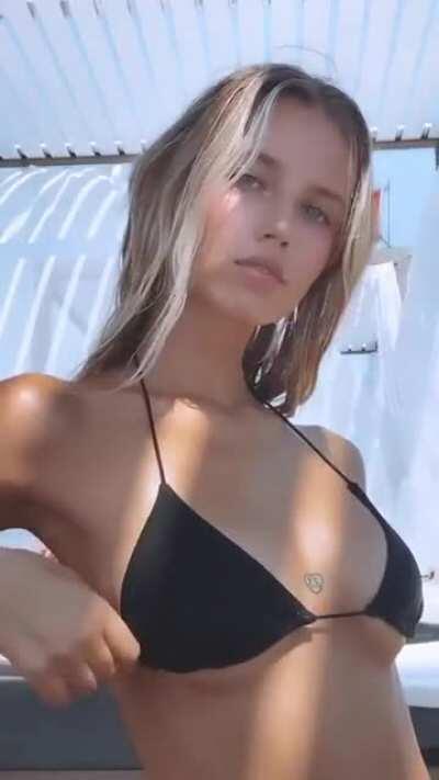 Adjusting Her Bikini