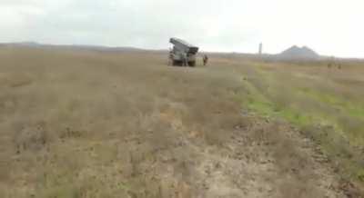 Ukrainian forces preparing rockets filled with written instructions on how to surrender, and firing them at Russian positions in Bakhmut
