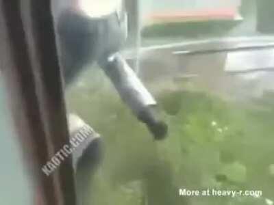 Russian dude tries to fight a tree in a rather peculiar way