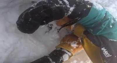 Situationally aware skier saves the life of snowboarder stuck upside down in the snow (NSFW: language)