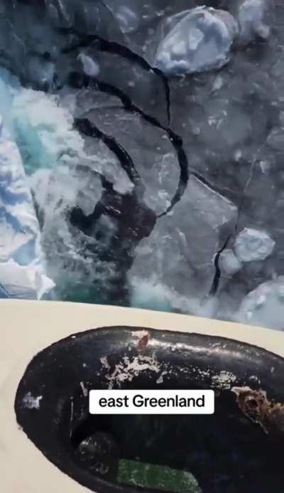 The bow of an icebreaker sailing in East Greenland.