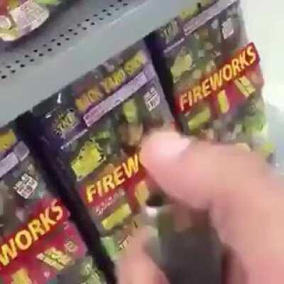 Guy lights Fire works at a Walmart