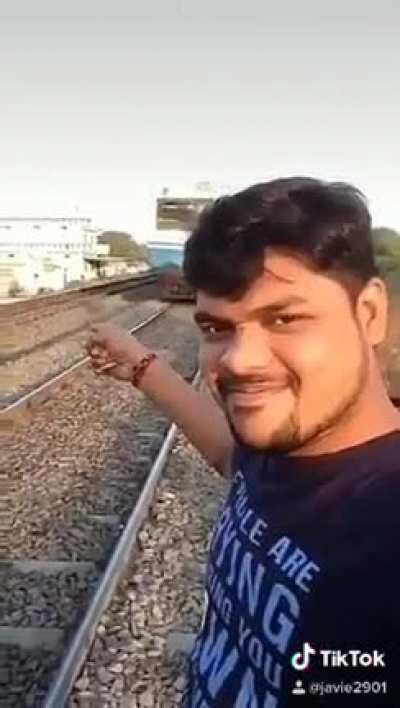 Taking a selfie near train tracks